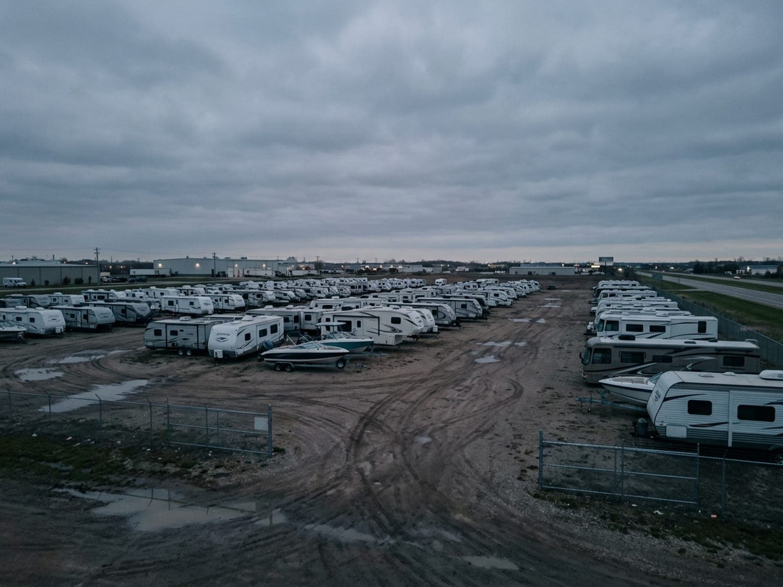 Overflow lots and weather-event exposure risk area at an RV & boat dealers site